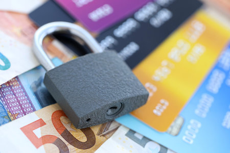 Euro money bills banknotes and credit cards with padlock. Concept of online banking safety and...