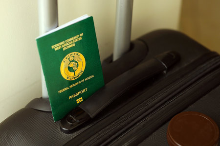 Nigerian passport on travel luggage close up. The concept of travel and vacationの写真素材