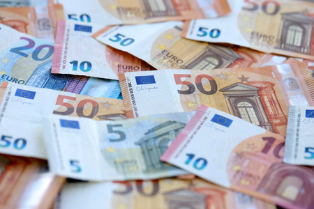Euro money bills banknotes in big amount on table close up. Huge quantity of European Union currency cash on smooth surface. Business and rich life conceptの写真素材