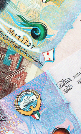 Kuwaiti dinar currency money bills. The current banknotes lies on table in big amount close up