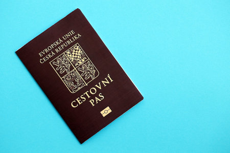 Czech biometrical passport on blue table background. Concept of citizenship of Czech Republicの写真素材