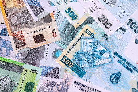 Congolese franc money bills in big amount on table close up. Business and economyの写真素材