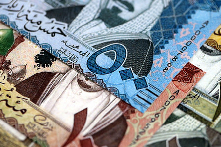 Saudi Arabia riyal money bills banknotes lies in big pile on table close up. Concept of finances and business in Saudi Arabiaの写真素材