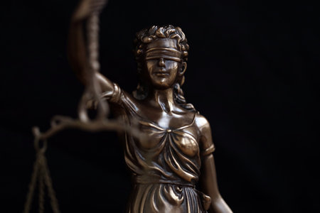 Lady Justice statue in law on black background. Law and justice concept