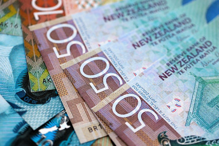 New Zealand dollar money bills in big amount on table close up. Rich life concept in New Zealand....