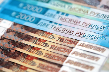 Russian ruble money bills banknotes lies in big pile on table close up. Concept of finances and...