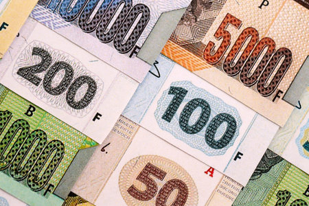 Congolese franc money bills in big amount on table close up. Rich life concept in Democratic...
