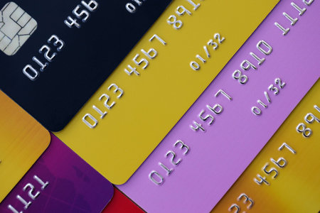 Many credit or debit cards with fictional specimen numbers. Big amount of banking plastic cards of various colors. Financial concept of business and e-commerceの写真素材