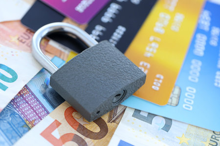 Euro money bills banknotes and credit cards with padlock. Concept of online banking safety and securityの写真素材