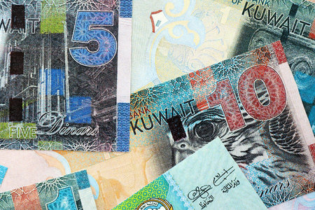 Kuwaiti dinar currency money bills. The current banknotes lies on table in big amount close up