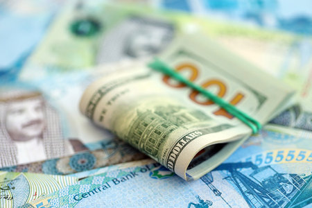 Bahraini dinar currency money bills and bunch of us dollar banknotes close up. The concept of...