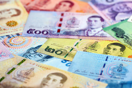 Thai baht currency money bills. The current banknotes lies on table in big amount close up
