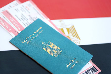 Egyptian passport and boarding pass tickets on flag close up. The concept of travel and vacationの写真素材