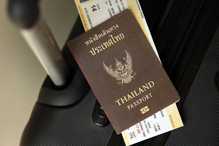Thai passport and avia tickets on travel bag close up. The concept of travel and vacation