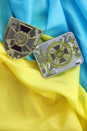 KYIV, UKRAINE - OCTOBER 7, 2025 State Border Guard Service of Ukraine patch on ukrainian flag close...