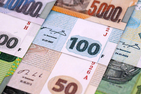 Congolese franc money bills in big amount on table close up. Rich life concept in Democratic...