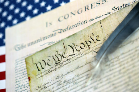 United States Bill of Rights Preamble to the Constitution and American Flag close up