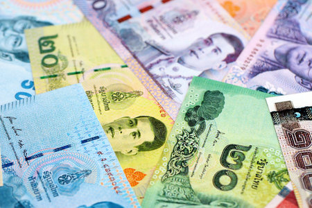 Thai baht currency money bills. The current banknotes lies on table in big amount close up