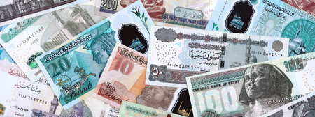 Egyptian pound currency money bills. The current banknotes lies on table in big amount close up