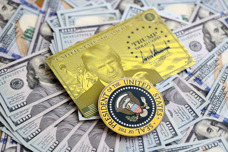KYIV, UKRAINE - DECEMBER 13, 2025 Trump gold card and Seal of US president on big amount of US...