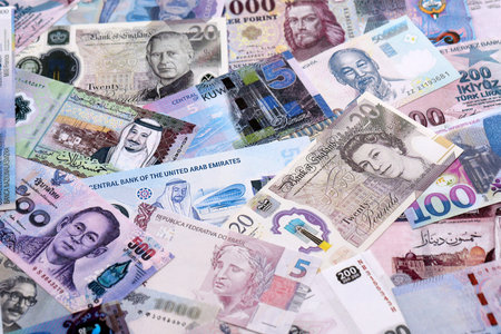 Big amount of various currencies money bills banknotes in full frame. Many cash bills from different...