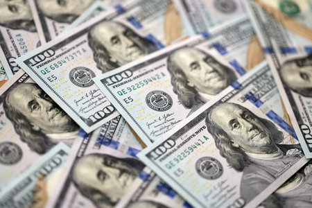 Money background with Franklin on the 100-dollar note. Texture of US dollar currency and banknotes....