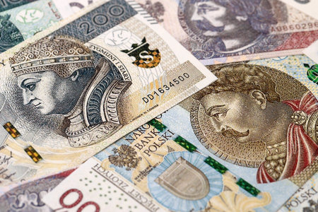 Big amount of polish zloty money bills banknotes close up. Huge pile of cash of Poland currency. Concept of business, economy and investment in Polandの写真素材