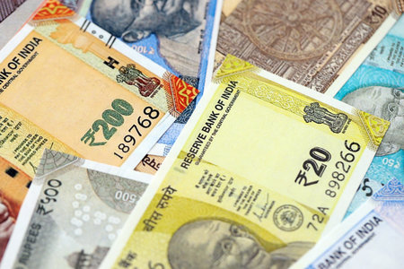 Big pile of Indian Rupees money bills banknotes close up. Lots of money of Indian INR currency cash...