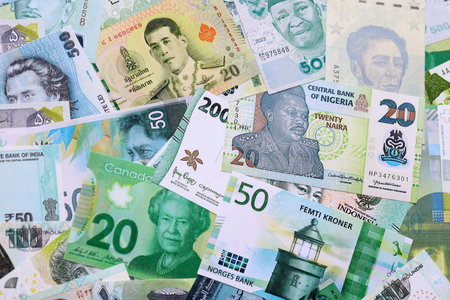 Various currencies money bills banknotes in green color. Many cash bills from different countries in...