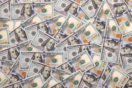 Money background with Franklin on the 100-dollar note. Texture of US dollar currency and banknotes....