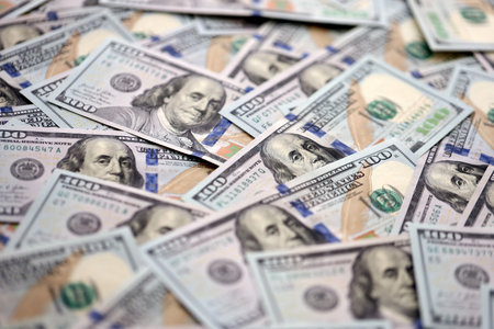Money background with Franklin on the 100-dollar note. Texture of US dollar currency and banknotes....