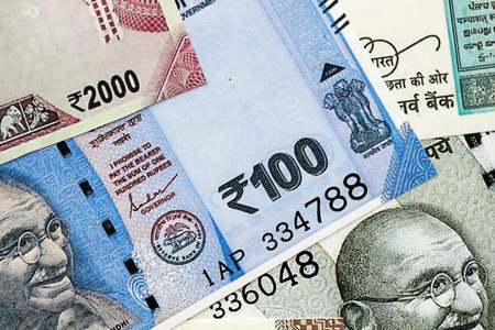 Big pile of Indian Rupees money bills banknotes close up. Lots of money of Indian INR currency cash...