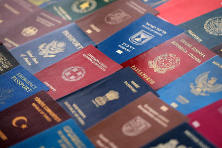 Big amount of passports of various different countries. Covers of expired passports close up. Travel...