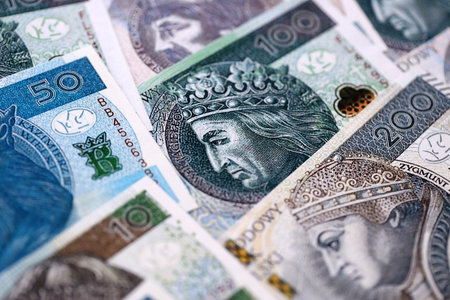 Big amount of polish zloty money banknotes close up. Huge pile of cash of Poland currency. Concept of business, economy and investment in Polandの写真素材