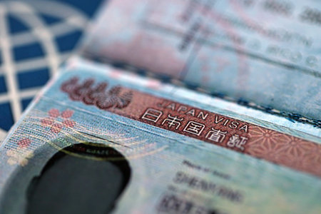 Detail of Japan visa applied on passport. Japanese visa header in passport page close upの写真素材