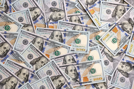 Money background with Franklin on the 100-dollar note. Texture of US dollar currency and banknotes....
