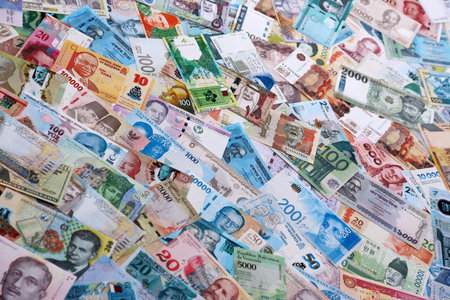 Money from different countries. Many random banknotes of various currency. Big amount of cash close...