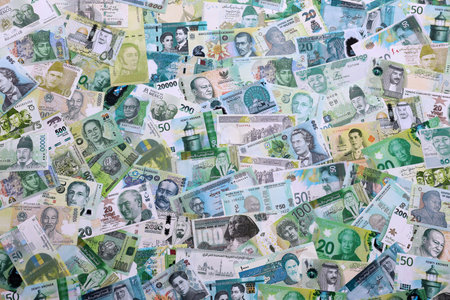 Various currencies money bills banknotes in green color. Many cash bills from different countries in...