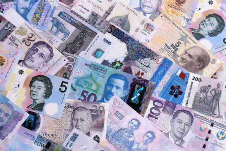 Big amount of various currencies money bills banknotes in full frame. Many cash bills from different...