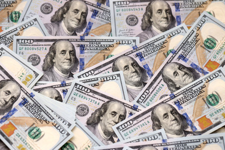 Money background with Franklin on the 100-dollar note. Texture of US dollar currency and banknotes....