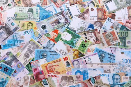 Many random banknotes of different currency. Big amount of random money bills close up. Currency...