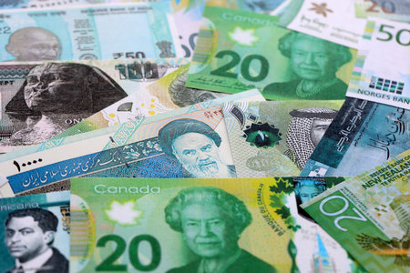 Various currencies money bills banknotes in green color. Many cash bills from different countries in...