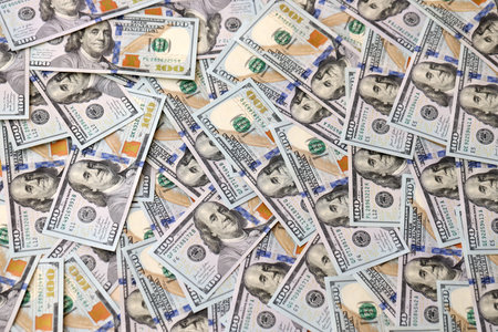 Money background with Franklin on the 100-dollar note. Texture of US dollar currency and banknotes....