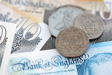 Coins and banknotes of United Kingdom and Great Britain pound currency. UK money close up. Business,...