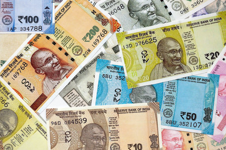 Big pile of Indian Rupees money bills banknotes close up. Lots of money of Indian INR currency cash...