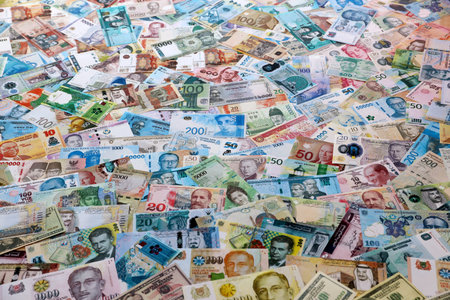 Many banknotes of different currency. Big amount of random money bills close up. Currency Exchange...