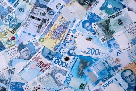 Various currencies money bills banknotes in full frame. Many cash bills from different countries in...