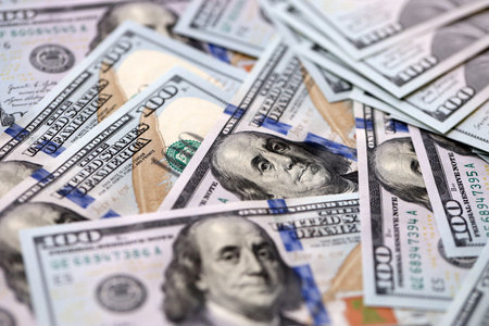 Many thousands of american dollars. Packs of one hundred dollars. New dollar bills, USD. Cash,...