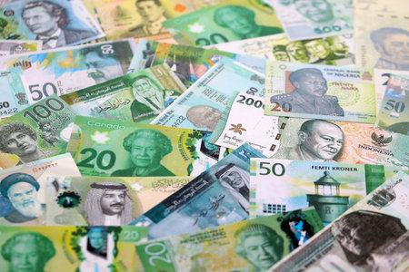 Various currencies money bills banknotes in green color. Many cash bills from different countries in...