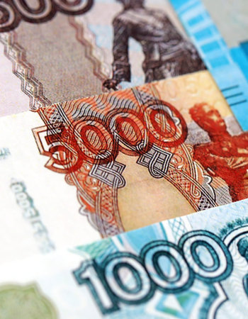 Russian ruble paper banknotes pile on table. Russia RUB currency money bills in big amount. Concept...